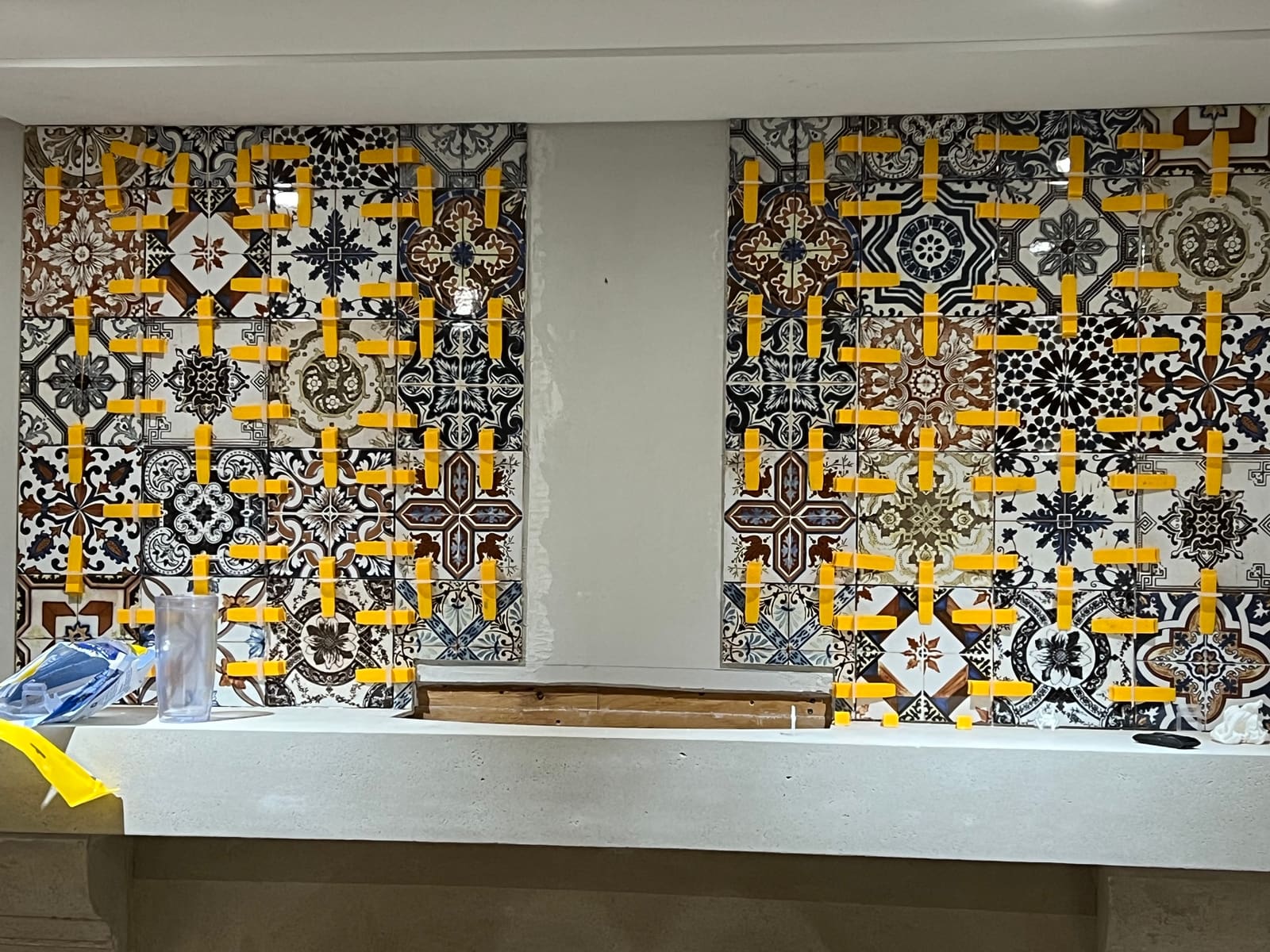 Patterned tile panels being installed