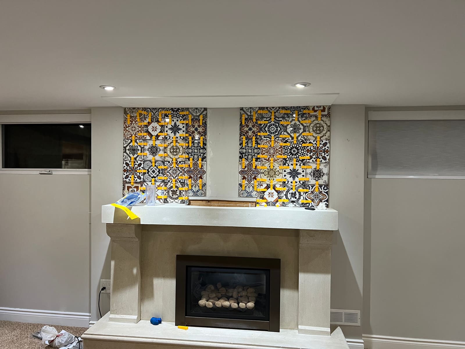 Fireplace wall with tile panels in progress