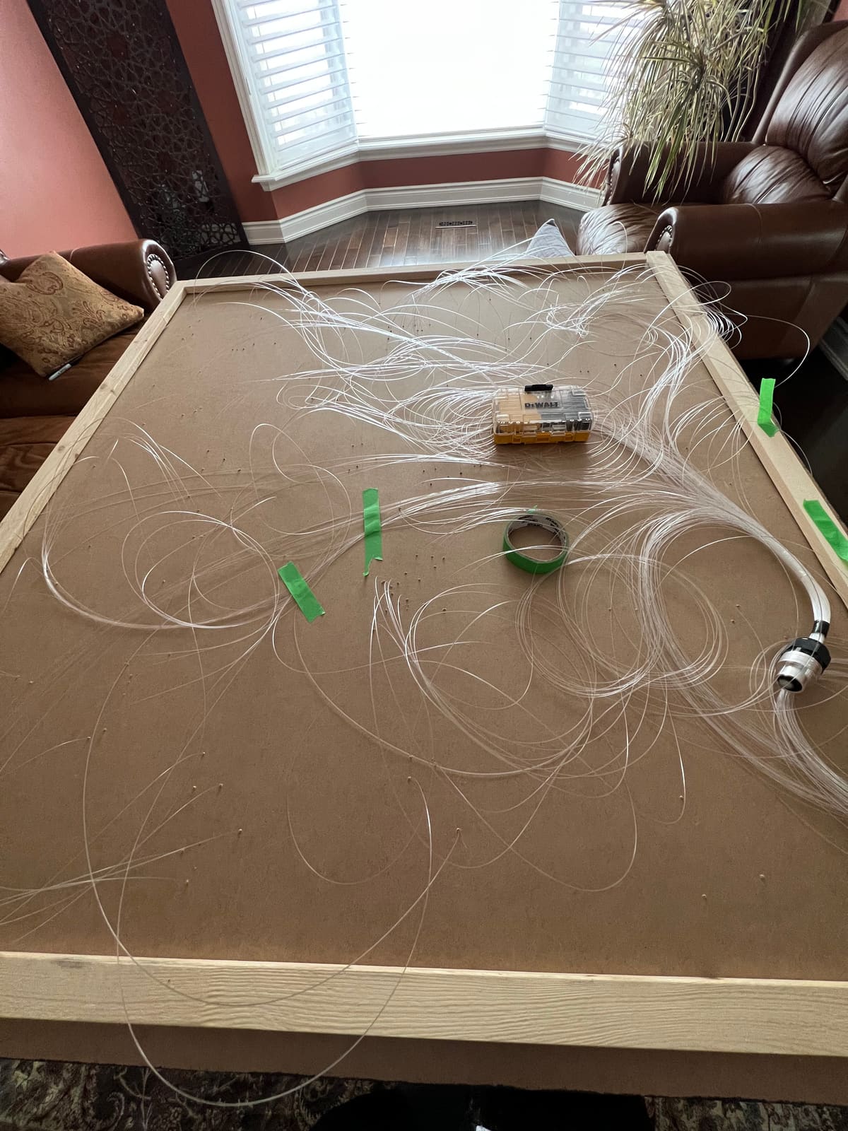 Fiber strands threaded through the panel