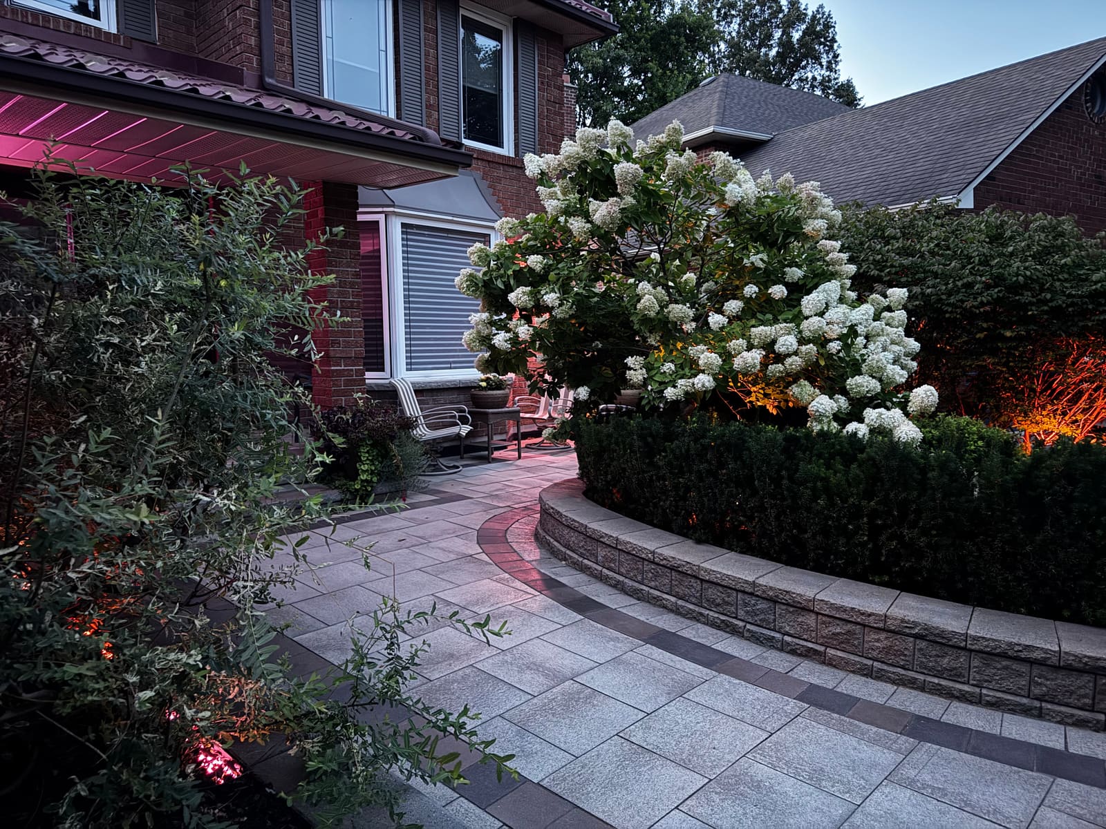 Lit walkway beside the house