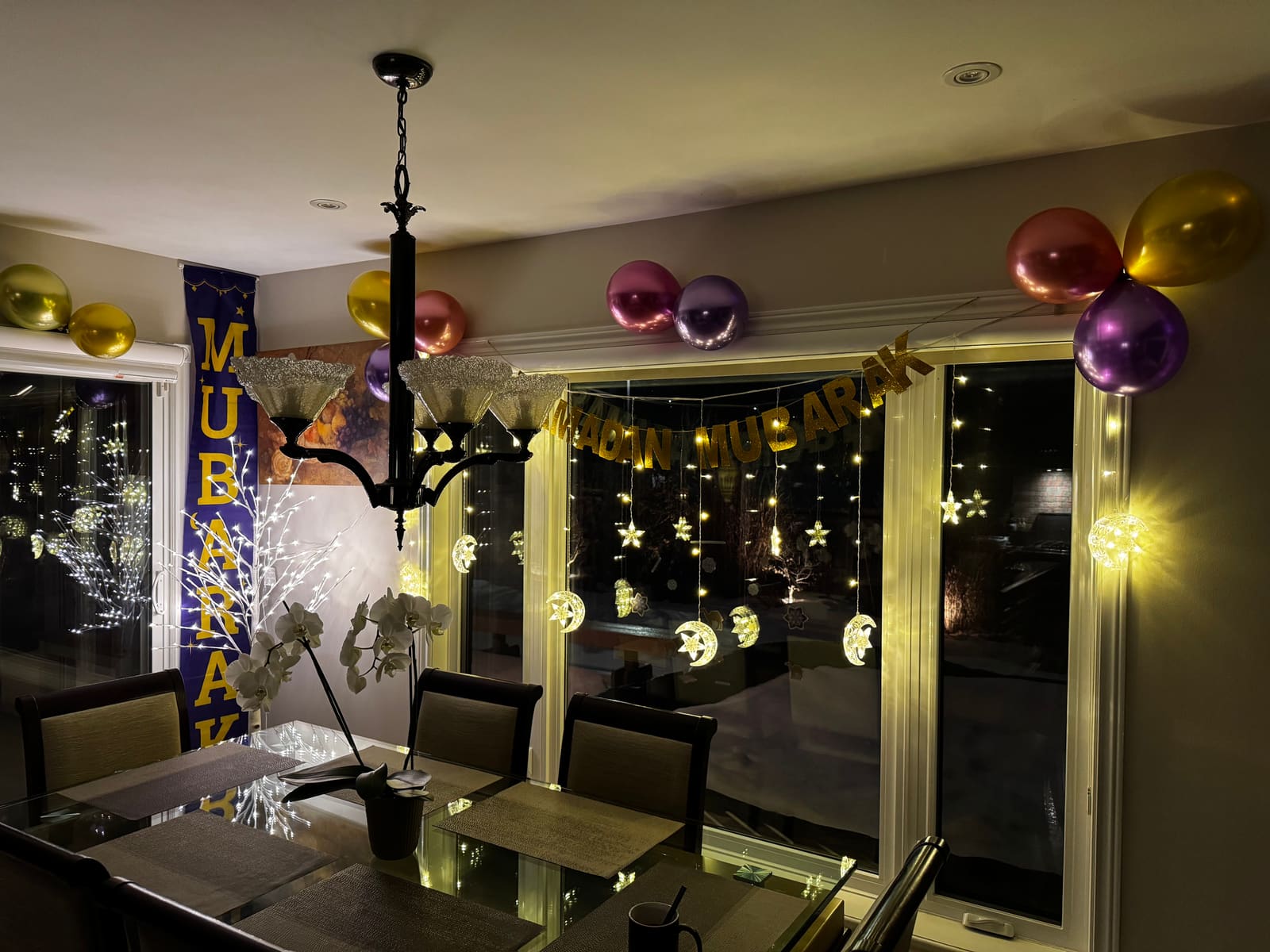 Star and crescent lights in the dining room windows