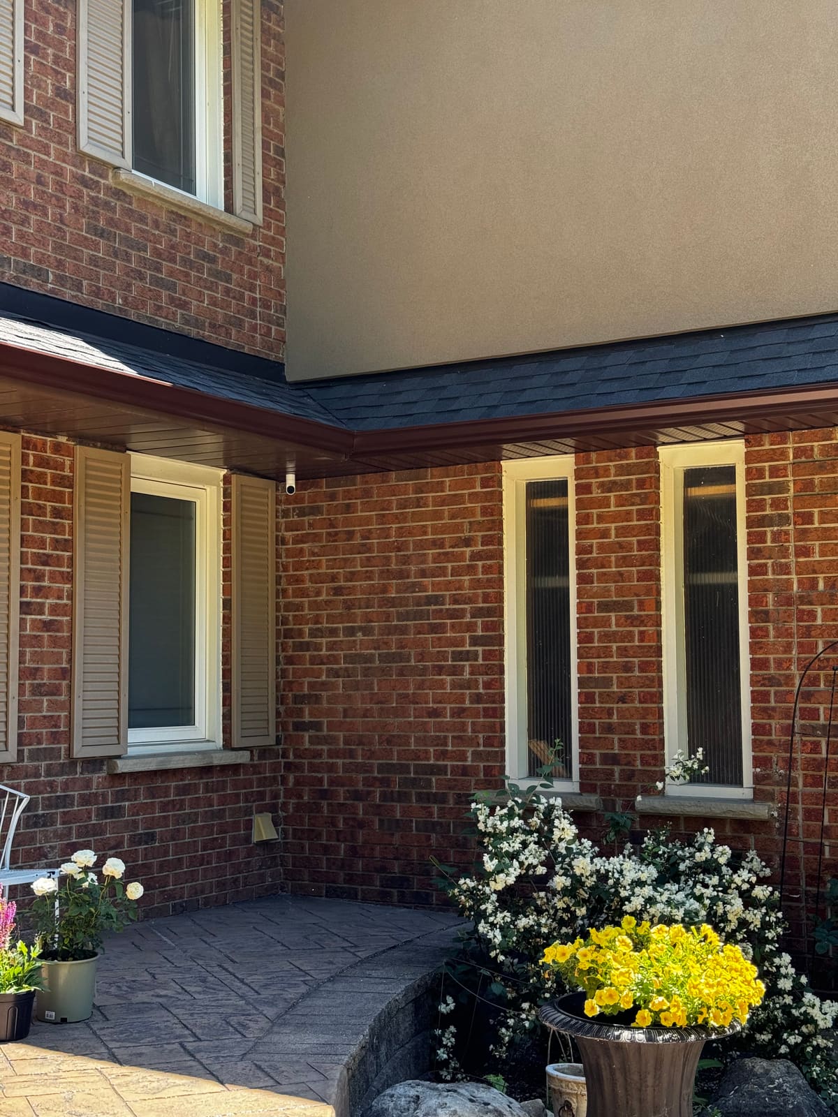 The front entrance covered by a soffit-mounted camera